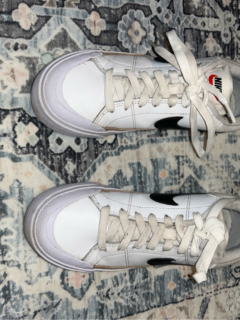 Nike White Low-Top Sneakers with Black Swoosh